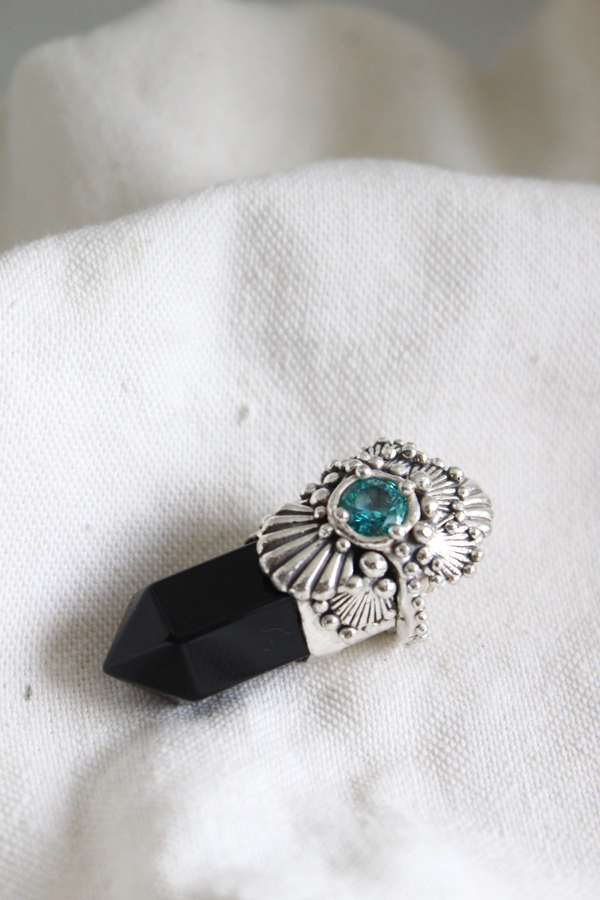 Amuleto conchas ónix negro