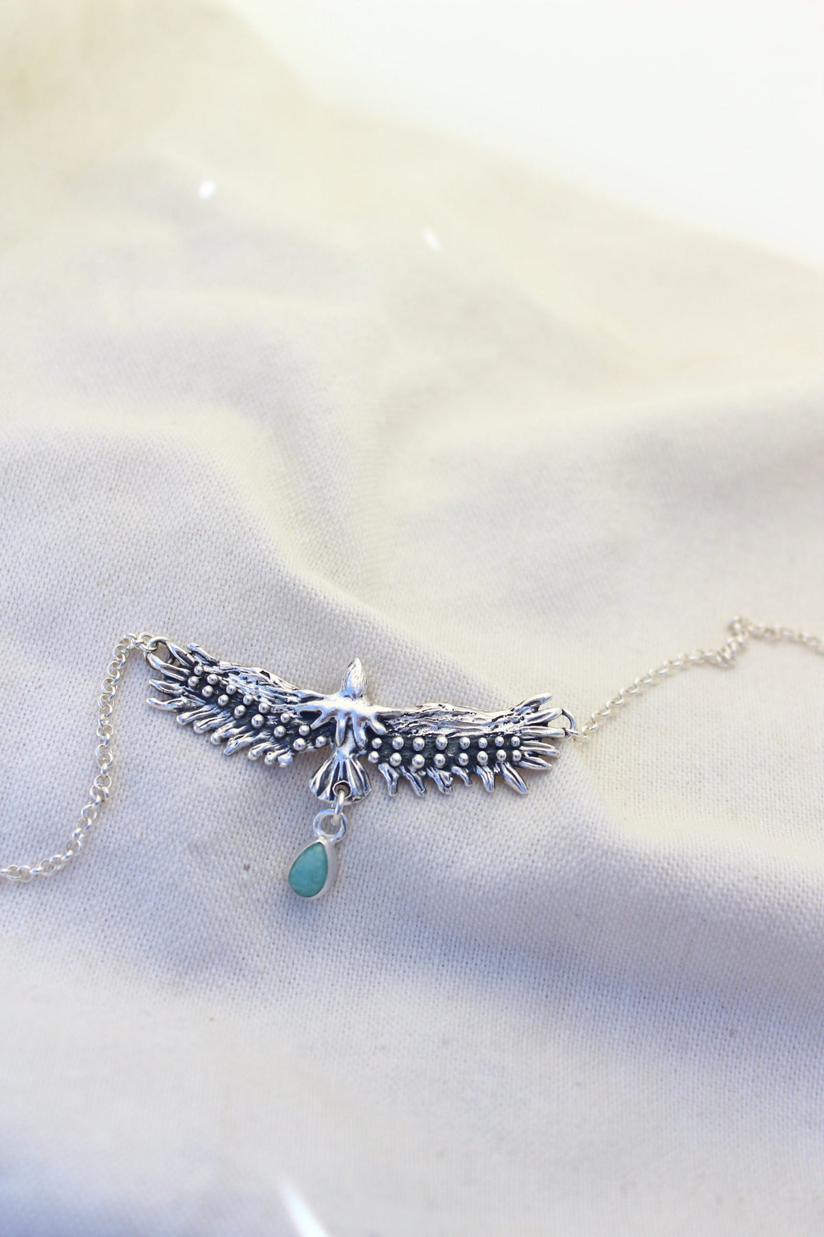 Conjunto collar águila sagrada + aros pluma Amazonita