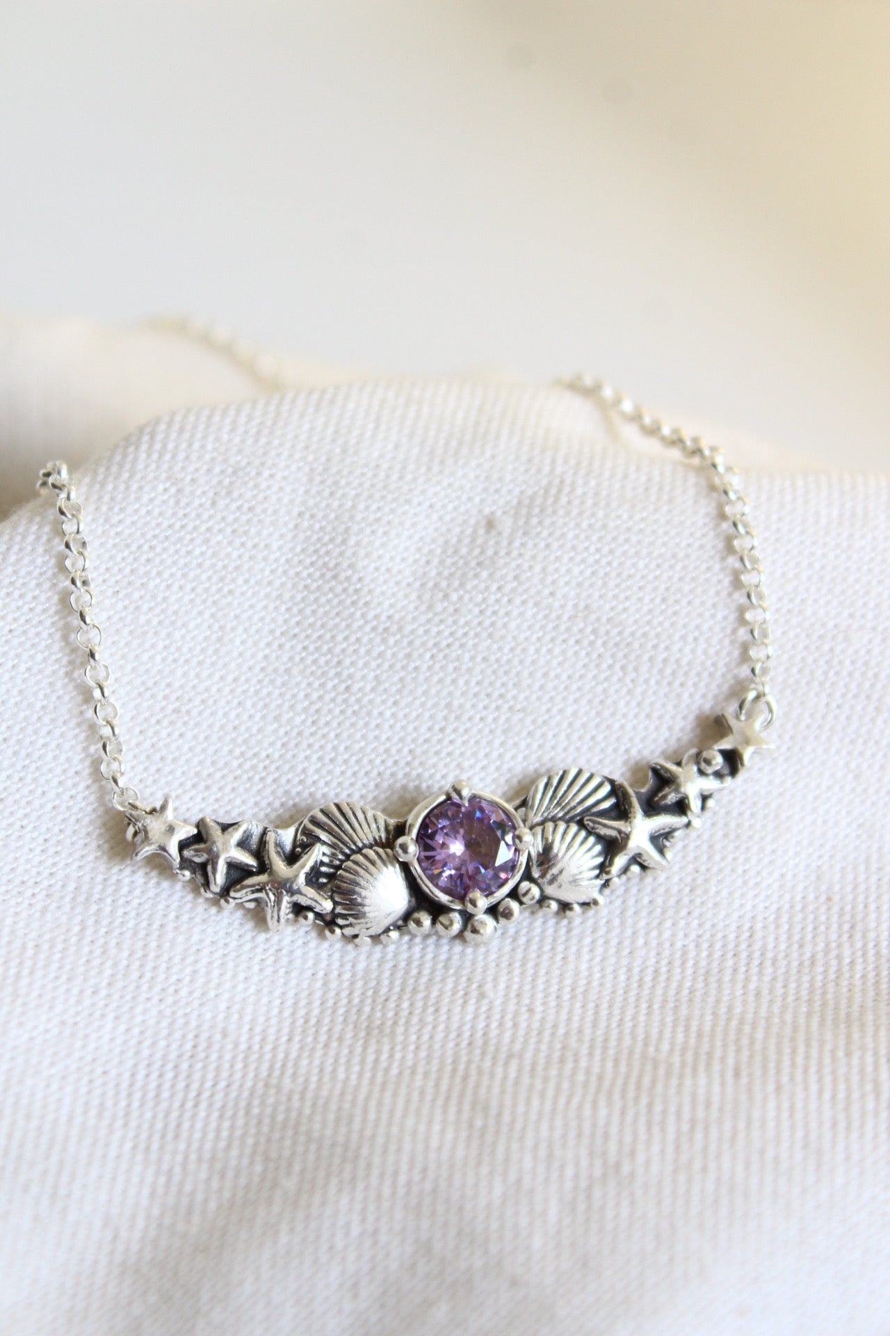 Collar hermandad cristal morado
