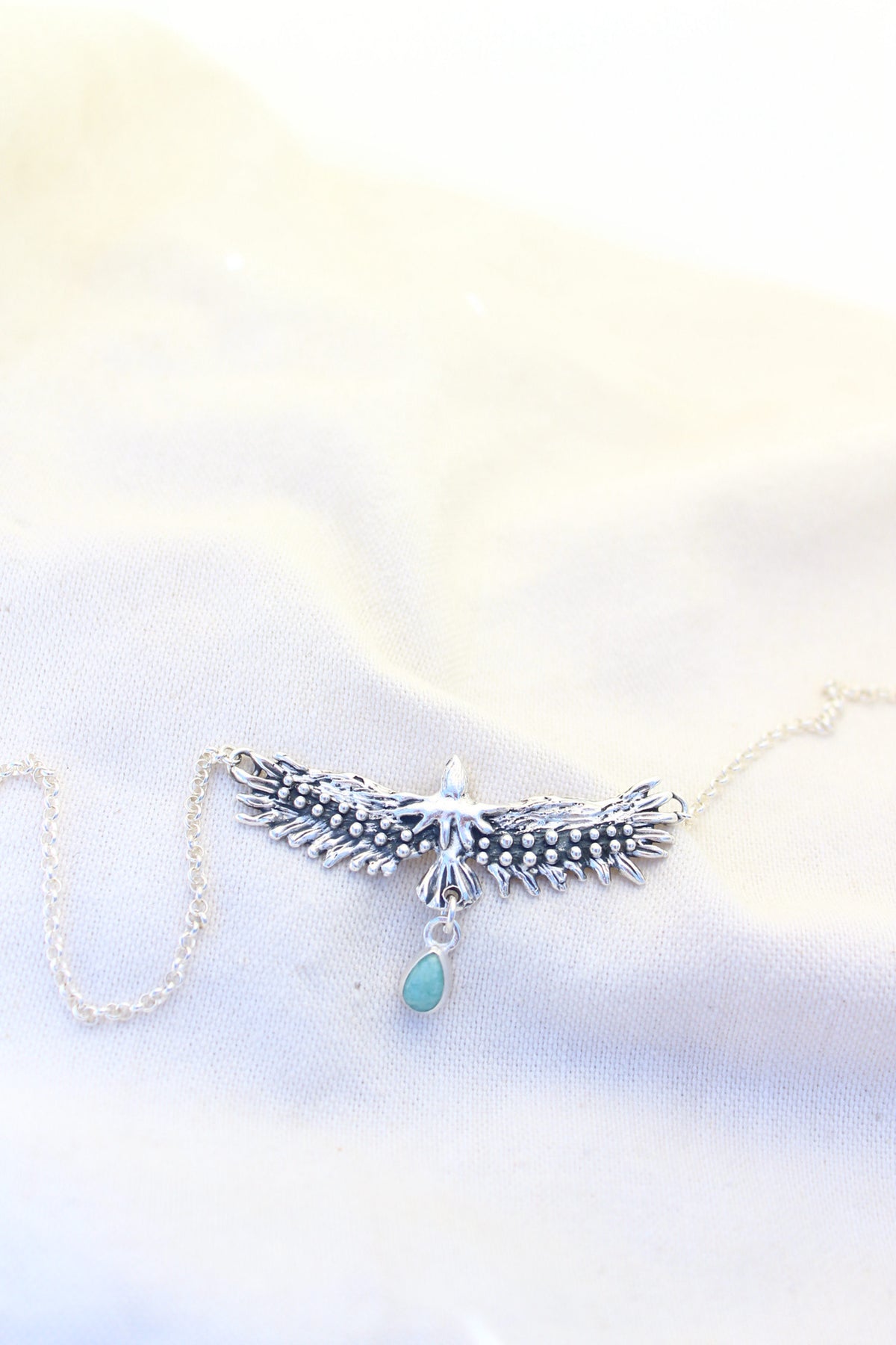 Conjunto collar águila sagrada + aros pluma Amazonita