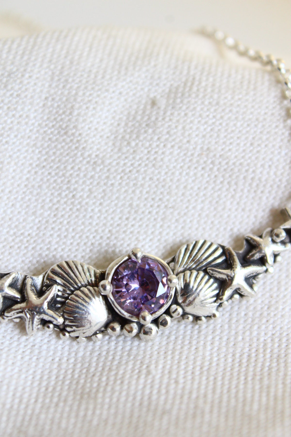 Collar hermandad cristal morado