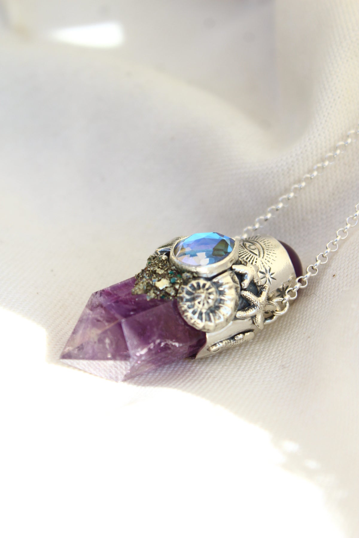 Amuleto Atlantis Ojo protector estrellado de mar